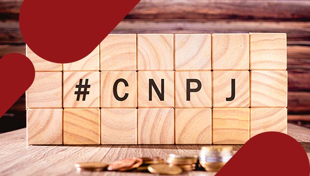 Na imagem, peças em madeira com a sigla CNPJ para representar o tema: "O que é CNPJ e como abrir um".